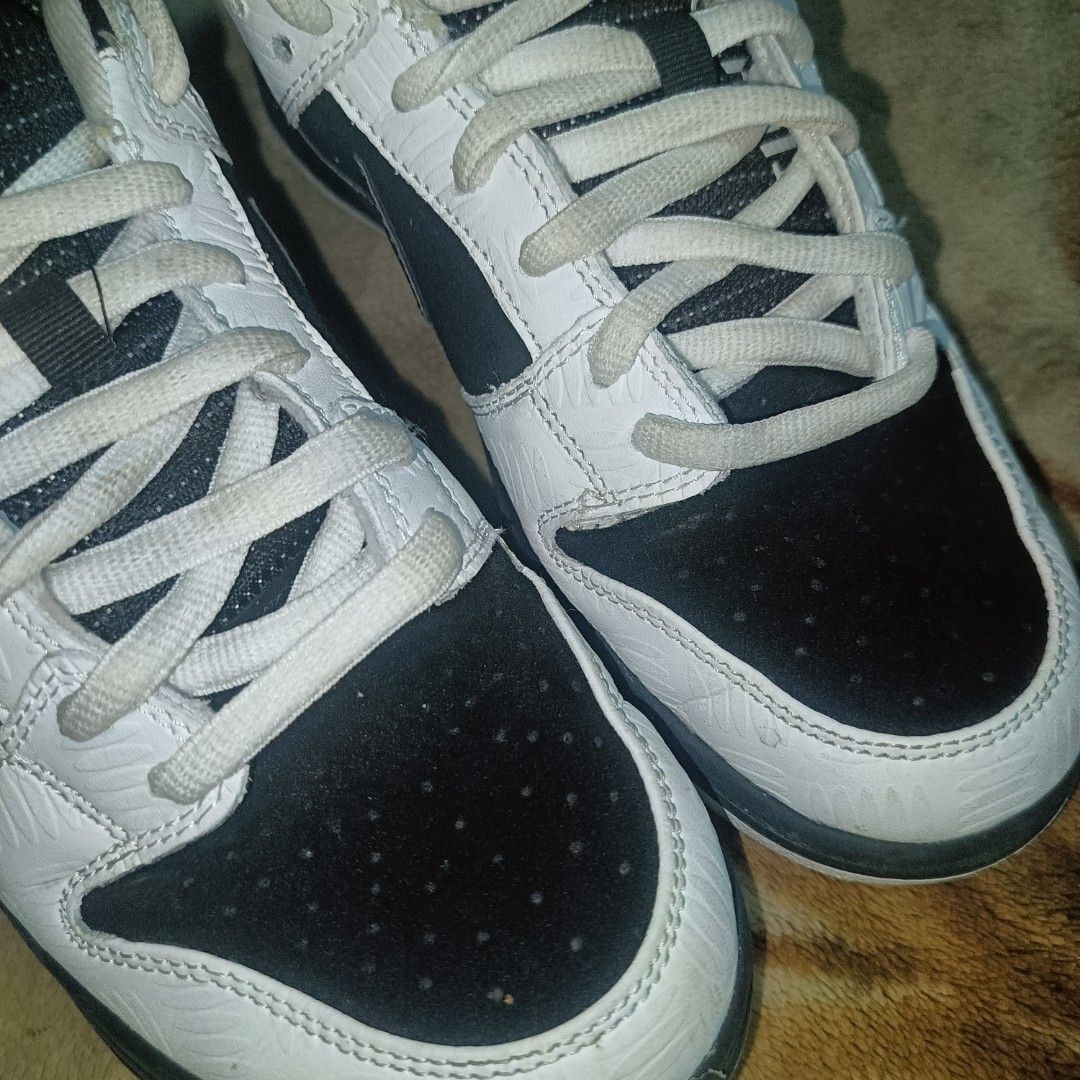 Nike SB Dunk Low Pro Black White (Category: Sneakers) located in Manila. Submitted by apparel_2025 (Listing ID 1431942794, Image 3). Description: - Nike SB Dunk Low Pro - Black and white colorway - Iconic Nike SB branding on the tongue - White laces - Black toe box - Shows wear on soles - Orange detail on insole - Size tag visible.