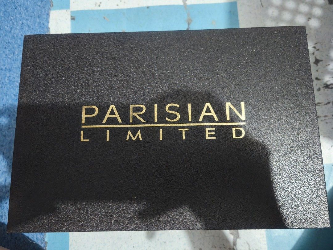 Parisian Limited Black Sandals (Category: Flats & Sandals) located in Caloocan City. Submitted by yyybba (Listing ID 1431844496, Image 2). Description: Elegant black sandals from Parisian Limited. Features a stylish design with a gold-colored heel. Includes an ankle strap with a buckle for a secure fit. Comes with the original box and packaging. The sandals appear unworn..