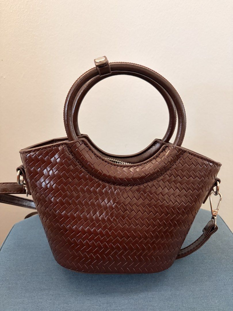 Parisian Woven Handbag in Brown (Category: Cross-body Bags) located in Las Pinas. Submitted by ynalcx (Listing ID 1431884511, Image 1). Description: - Bought last week lang sa dept store for 800 pesos - Opened but not used - Can be worn as a crossbody bag - Fits a small wallet, make up, a phone - RFS: Impulse buy .