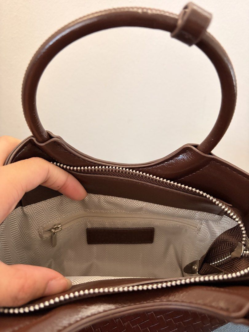 Parisian Woven Handbag in Brown (Category: Cross-body Bags) located in Las Pinas. Submitted by ynalcx (Listing ID 1431884511, Image 3). Description: - Bought last week lang sa dept store for 800 pesos - Opened but not used - Can be worn as a crossbody bag - Fits a small wallet, make up, a phone - RFS: Impulse buy .