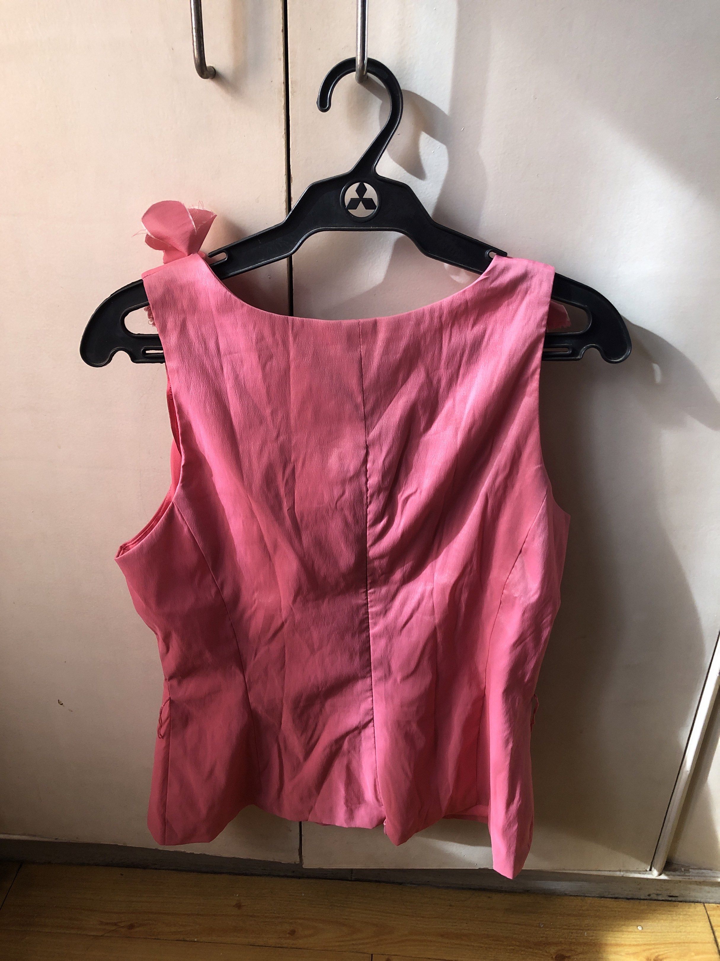 Pink Sleeveless Top with Ruffles (Category: Sleeveless) located in Paranaque City. Submitted by commandercinnabutt (Listing ID 1431873998, Image 2). Description: - Pink Cache top - Sleeveless design - Ruffled neckline - Smooth fabric - Tailored fit - Perfect for a chic, feminine look.