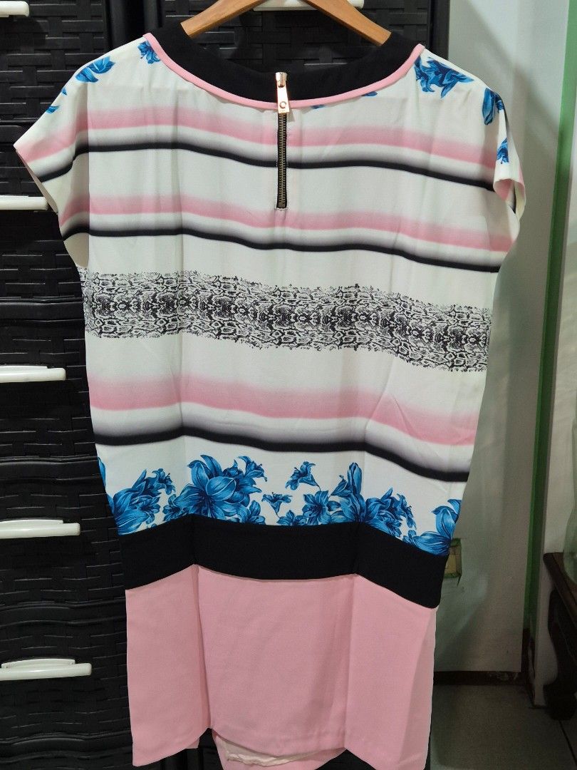 PINKO Tunic Midi length dress (Category: Dresses) located in Quezon City. Submitted by redragtag (Listing ID 1431852876, Image 3). Description: Spring-summer 2014 collection multi color printed dress round neckline, short dolman sleeves, distinctive asymmetrical hem with a slide slit. Functional exposed zip closure at the neckline (back detail). Like new Made in Italy.