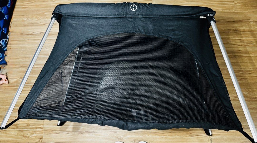 Portable Baby Bassinet (Category: Cots & Cribs) located in Makati City. Submitted by maried05 (Listing ID 1431943242, Image 2). Description: - Portable bassinet - Black mesh design for breathability and visibility - Sturdy frame - Comfortable sleeping surface - Easy to set up and fold down - Ideal for travel or home use - Provides a safe and cozy space for your baby Measurement: 36 x 22 inches Used just for 3 days during our SG trip *Baby in pict