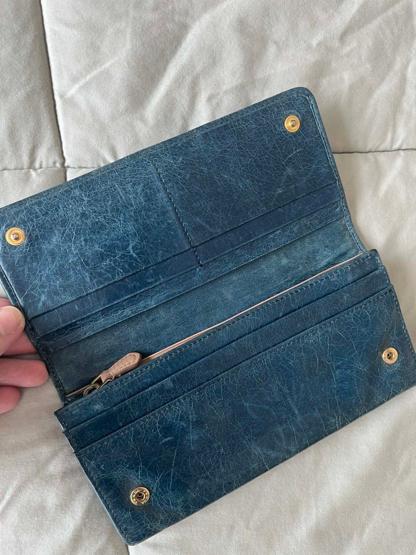 Prada wallet (distressed design) (Category: Luxury Bags & Wallets) located in Pasig City. Submitted by cjdlcmp (Listing ID 1431807376, Image 3). Description: Prada wallet (distressed design).