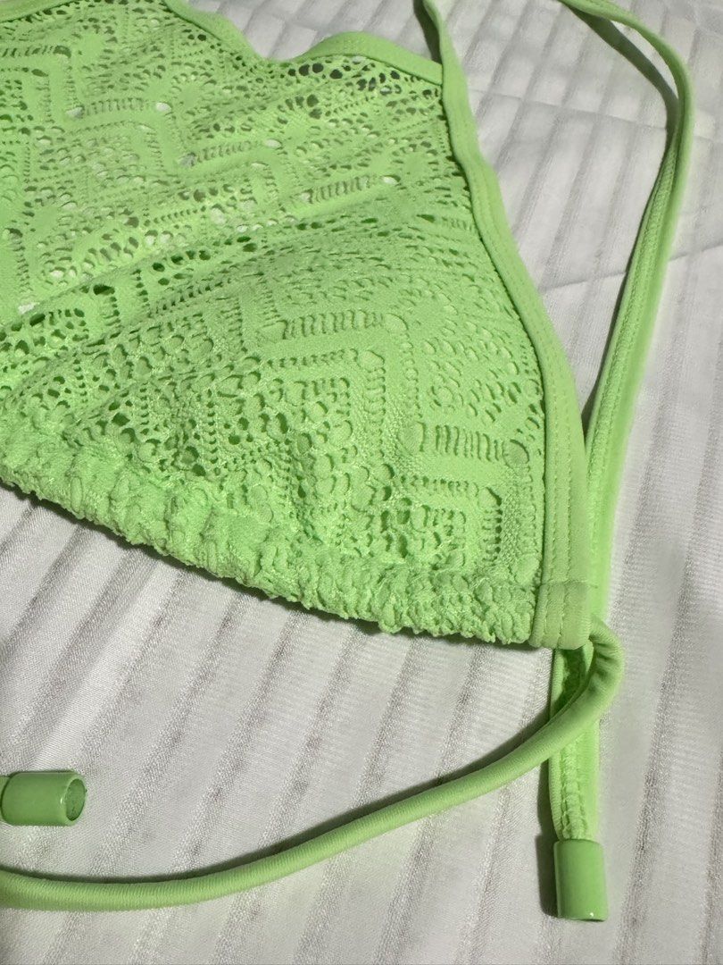 PRELOVED Neon Green Halter Bikini Top (Category: Bikinis & Swimsuits) located in Las Pinas. Submitted by itb.insidethebox (Listing ID 1431980650, Image 3). Description: PRELOVED (no tag) - Neon green bikini top - Halter neck design - Adjustable ties - Unique lace-like pattern - Triangle-shaped top - Includes padding PADDED AND SELFTIE SIZE: XS.
