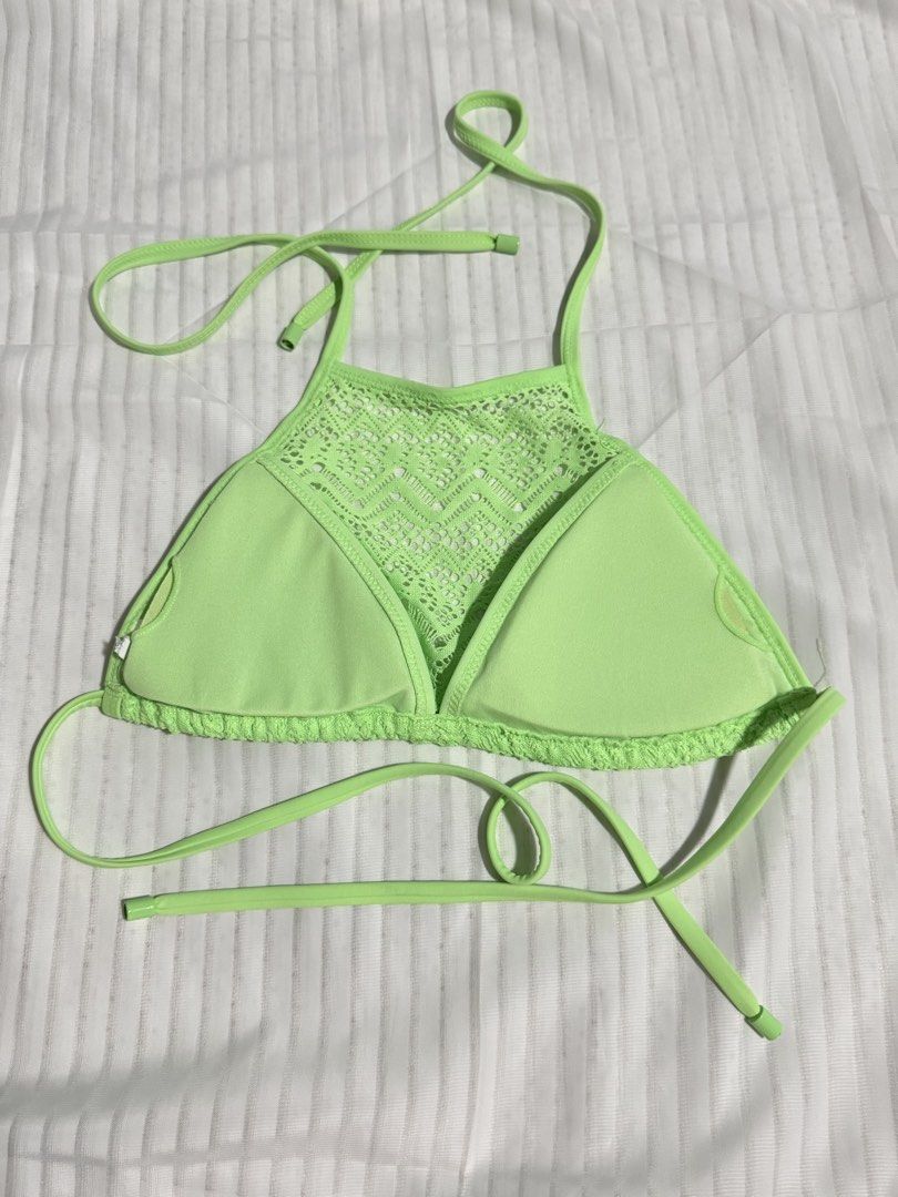 PRELOVED Neon Green Halter Bikini Top (Category: Bikinis & Swimsuits) located in Las Pinas. Submitted by itb.insidethebox (Listing ID 1431980650, Image 2). Description: PRELOVED (no tag) - Neon green bikini top - Halter neck design - Adjustable ties - Unique lace-like pattern - Triangle-shaped top - Includes padding PADDED AND SELFTIE SIZE: XS.