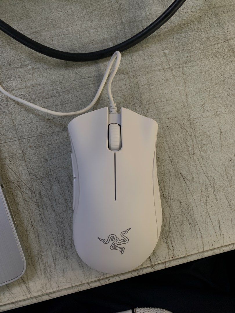 Razer DeathAdder Essential White Edition (Category: Mouse & Mousepads) located in Manila. Submitted by justin.580 (Listing ID 1431863360, Image 2). Description: ORIGINAL PRICE: $29.99 I HAD IT SINCE JANUARY 2026 BUT DOESNT USE IT - Razer DeathAdder Essential gaming mouse - Features Razer logo - Two side buttons - Wired connection - Comes with original box.
