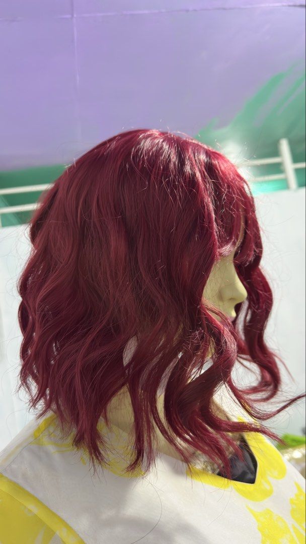 Red Wavy Wig with Bangs (Category: Hair Accessories) located in Angeles City. Submitted by clmsnw01 (Listing ID 1431966051, Image 1). Description: - Red, wavy wig - Features bangs - Short style - Styled on a mannequin - Ready to wear - Transforms your look instantly.