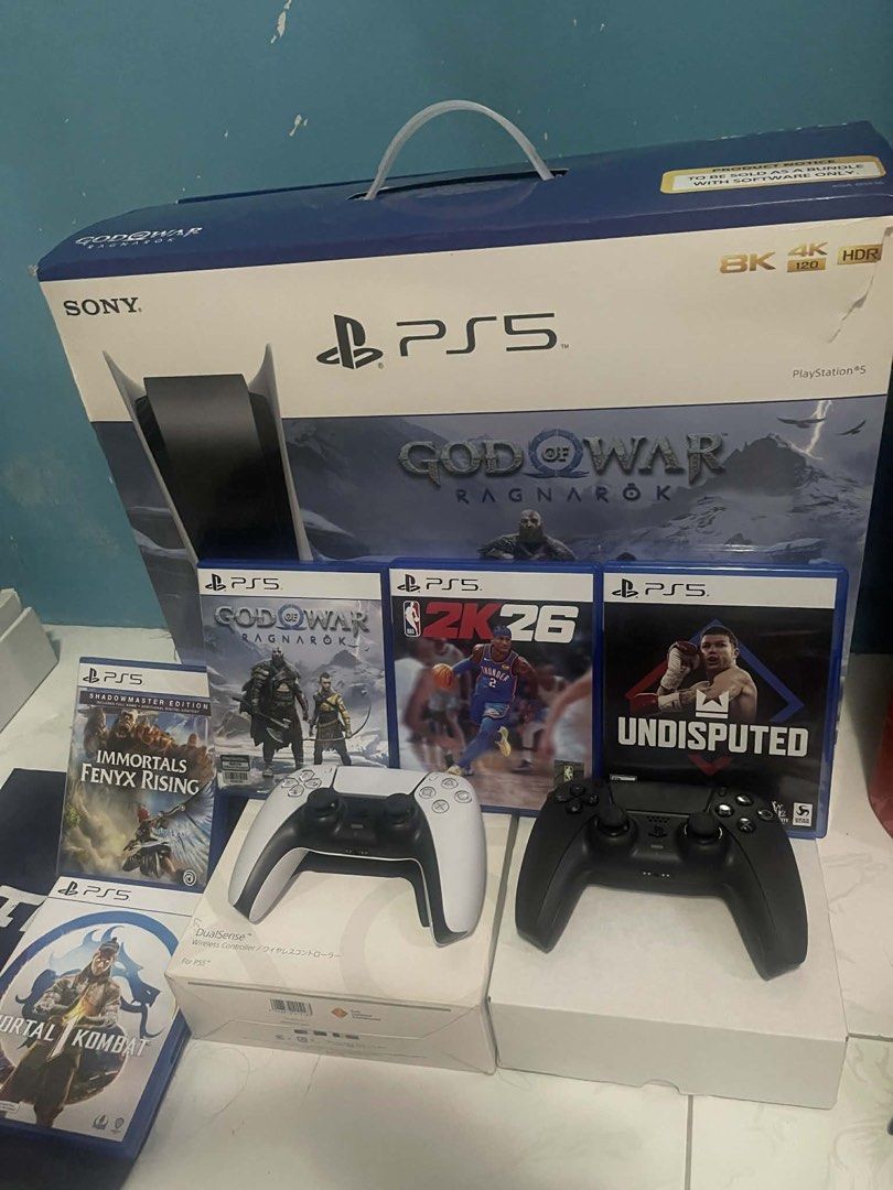 Sony PlayStation 5 Console Bundle (Category: PlayStation) located in Manila. Submitted by cutie_rara (Listing ID 1431829687, Image 2). Description: - PlayStation 5 console included - Two controllers: white and black - Five games: - God of War Ragnarok - 2K26 - Undisputed - Mortal Kombat - Immortals Fenyx Rising - Original box included - Ready for hours of gaming! SEND OFFER but be reasonable. I’ll decline if you’re a low-baller. Will include extr
