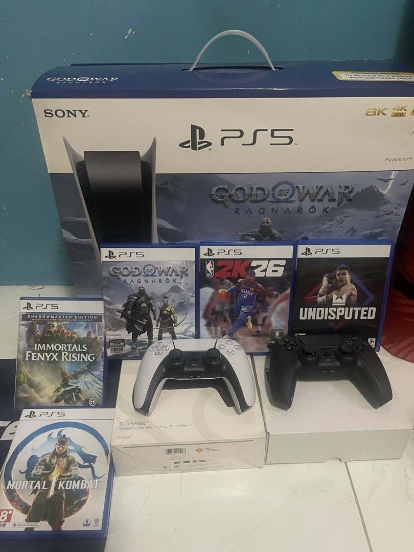 Sony PlayStation 5 Console Bundle (Category: PlayStation) located in Manila. Submitted by cutie_rara (Listing ID 1431829687, Image 3). Description: - PlayStation 5 console included - Two controllers: white and black - Five games: - God of War Ragnarok - 2K26 - Undisputed - Mortal Kombat - Immortals Fenyx Rising - Original box included - Ready for hours of gaming! SEND OFFER but be reasonable. I’ll decline if you’re a low-baller. Will include extr