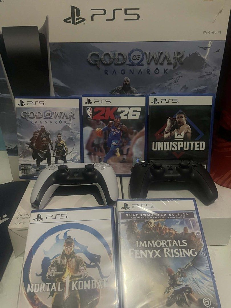 Sony PlayStation 5 Console Bundle (Category: PlayStation) located in Manila. Submitted by cutie_rara (Listing ID 1431829687, Image 1). Description: - PlayStation 5 console included - Two controllers: white and black - Five games: - God of War Ragnarok - 2K26 - Undisputed - Mortal Kombat - Immortals Fenyx Rising - Original box included - Ready for hours of gaming! SEND OFFER but be reasonable. I’ll decline if you’re a low-baller. Will include extr