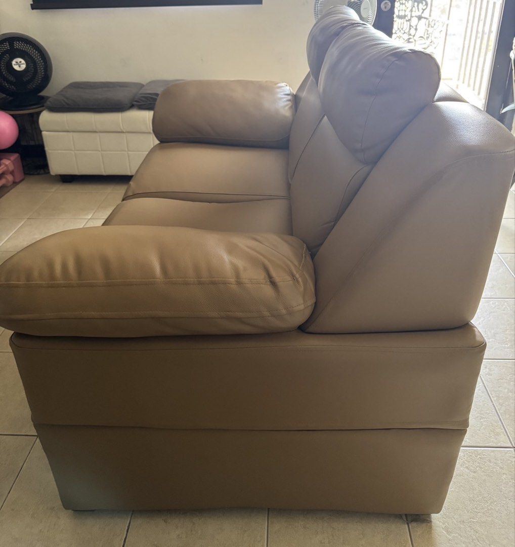 Tan Leather 2-Seater Sofa (with minor scratch) (Category: Sofas) located in Manila. Submitted by dondonc1026 (Listing ID 1431874817, Image 2). Description: Bought at SM Megamall Y2025 around 20k+ - Two-seater tan leather sofa - Features cushioned seats and armrests - Comfortable cushioned backrest - Modern design - Well-maintained condition - Ideal for living rooms and lounge areas.
