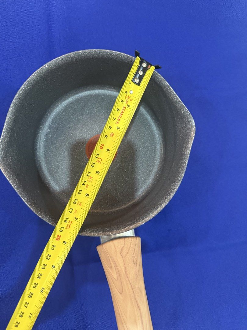 T-fal Non-Stick Fry Pan Set (Category: Cookware & Accessories) located in Marikina City. Submitted by dfsapo (Listing ID 1431811187, Image 3). Description: - T-fal non-stick pan set - Includes: - Small saucepan (approx. 14cm diameter) - Medium wok-style pan - Large fry pan (approx. 28cm diameter) - Stylish wooden-look handles - Attractive speckled gray interior - Patterned bottom design.