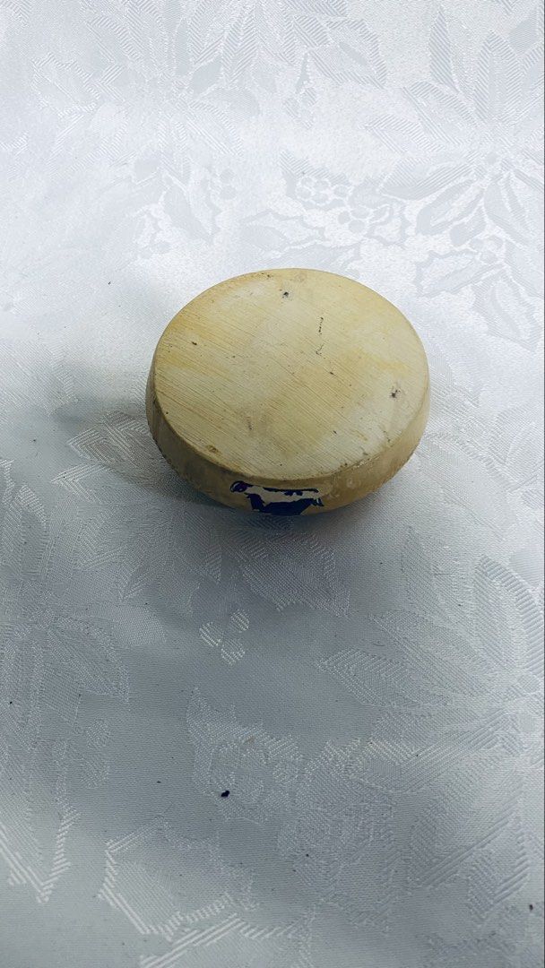 Vintage ceramic pixie pin tray (Category: Other Home Decor) located in Quezon City. Submitted by smithram (Listing ID 1431883483, Image 3). Description: Vintage pixie pin tray features a unique design with the word "Whitby" and a small illustration. It has a textured exterior with small, dark-colored dots. It has a circular shape with a recessed area for holding items. The pixie pin tray is approximately 10cm in diameter..