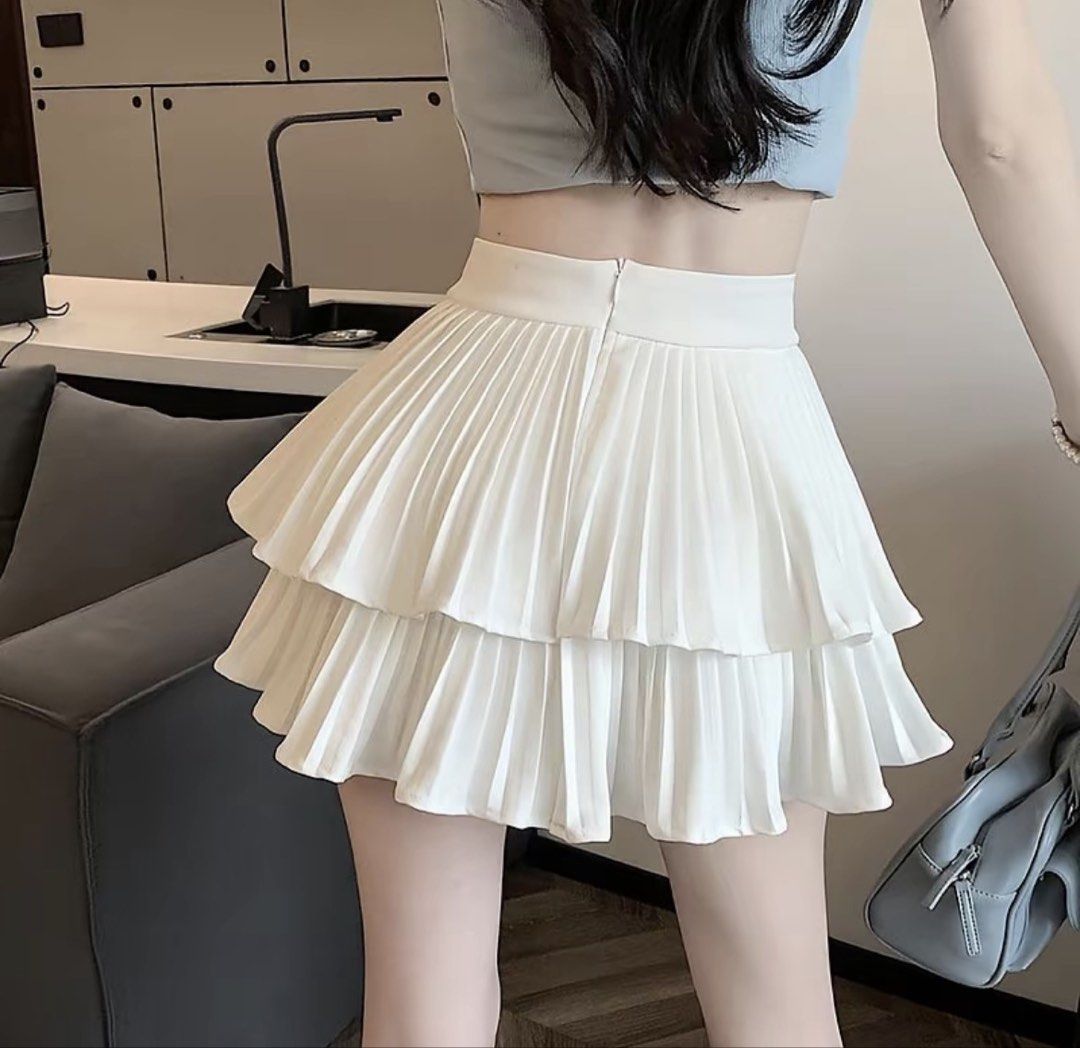 White Pleated Layered Mini Skirt (Category: Skirts) located in Manila. Submitted by riided (Listing ID 1431833142, Image 2). Description: used once nung fanmeet lang - White mini skirt - Pleated design - Layered style - High waist - Back zipper closure - Lightweight fabric - Versatile for casual or dressy outfits.