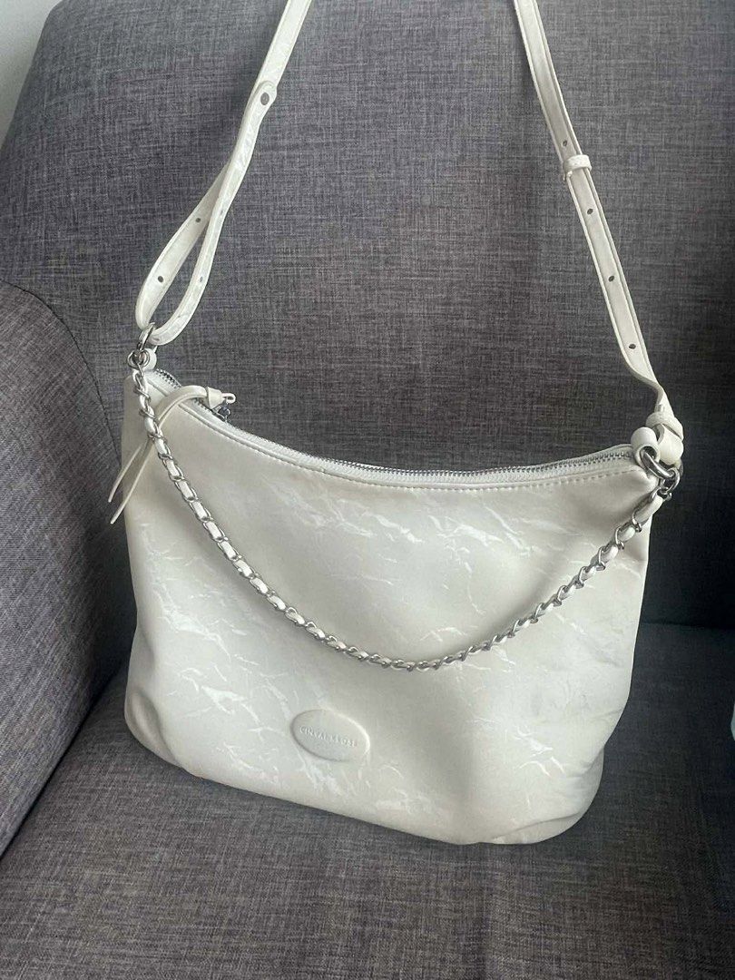 Korean Style White Shoulder/Hand Bag (Category: Shoulder Bags) located in Manila. Submitted by misyeli (Listing ID 1431878181, Image 1). Description: - white shoulder bag (cinvatti rose) - Silver chain detail - Adjustable long strap - Zipper closure - Subtle textured pattern - Medium size - Suitable for everyday use.