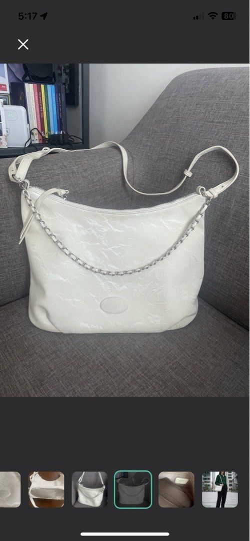Korean Style White Shoulder/Hand Bag (Category: Shoulder Bags) located in Manila. Submitted by misyeli (Listing ID 1431878181, Image 2). Description: - white shoulder bag (cinvatti rose) - Silver chain detail - Adjustable long strap - Zipper closure - Subtle textured pattern - Medium size - Suitable for everyday use.