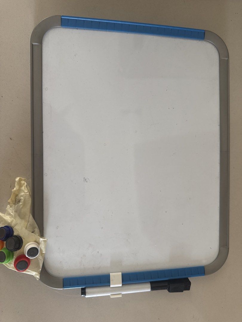 Whiteboard with Accessories (Category: Stationery & School Supplies) located in Manila. Submitted by decluterthings888 (Listing ID 1431865749, Image 1). Description: - Whiteboard with blue and gray frame - Includes marker and magnetic accessories - Clean and ready for use - Perfect for home, office, or school - Comes with a set of colorful magnetic markers SHORT BOND PAPER estimate size more or less.