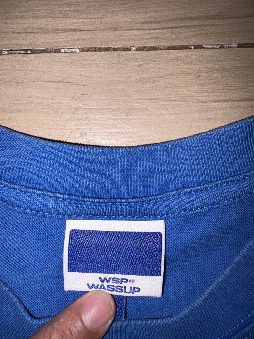 WSP Wassup Blue T-shirt (Category: Tshirts & Polo Shirts ) located in Manila. Submitted by jlogup08 (Listing ID 1431978059, Image 2). Description: - WSP Wassup T-shirt - Crew neck design - Short sleeves - Features the "wassup" logo in white print - Brand new with tags.
