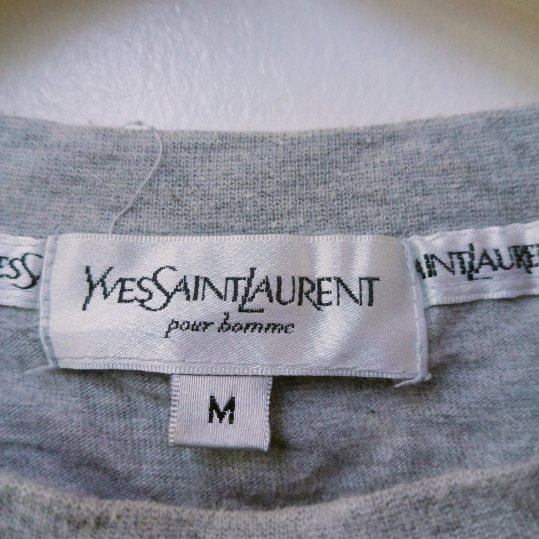 YSL vintage pour Homme script design tshirt (Category: Luxury Apparel) located in Cebu City. Submitted by bsidethrift (Listing ID 1431928597, Image 3). Description: orig 💯 Medium 20 pit to pit 27 length excellent condition.