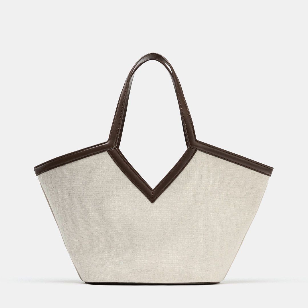 ZARA canvas cut-out shopper bag (Category: Shoulder Bags) located in Malolos. Submitted by topicksph (Listing ID 1431965859, Image 1). Description: ZARA canvas cut-out shopper bag ~ complete inclusions (cloth bag & paperbag) actual photos posted already Model height: 177 cm Shopper bag with a canvas top. Shoulder strap. Removable inner bag with zip closure. Tie closure. Height x Length x Width: 19 x 37 x 12.5 cm OUTER SHELL MAIN FABRIC 100% cotto