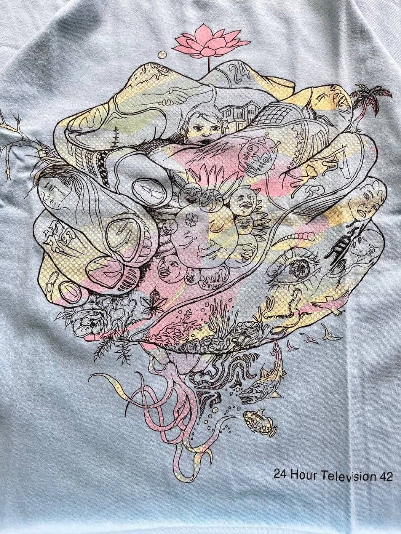 24 Hour Television 42 T-shirt (Category: Tshirts & Polo Shirts ) located in Bulacan. Submitted by thr1ft_things (Listing ID 1432185697, Image 2). Description: Light blue t-shirt with a unique graphic print. Features a crew neck and short sleeves. The graphic print includes various detailed illustrations and the text "24 Hour Television 42". The tag indicates a size M. Measurements are approximately 18 inches across the chest and 25 inches in leng