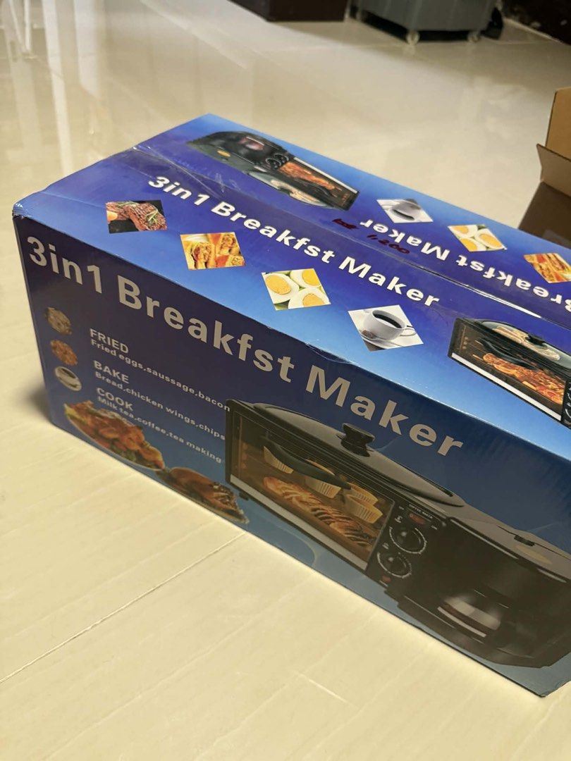 3-in-1 Breakfast Maker (Category: Coffee Machines & Makers) located in Quezon City. Submitted by happystar_f40583 (Listing ID 1432050387, Image 2). Description: - 3-in-1 Functionality: Fry, Bake, and Brew - Cook eggs, sausage, bacon - Bake bread, chicken wings, chips - Brew milk tea and coffee - Prepare a complete breakfast with one appliance.