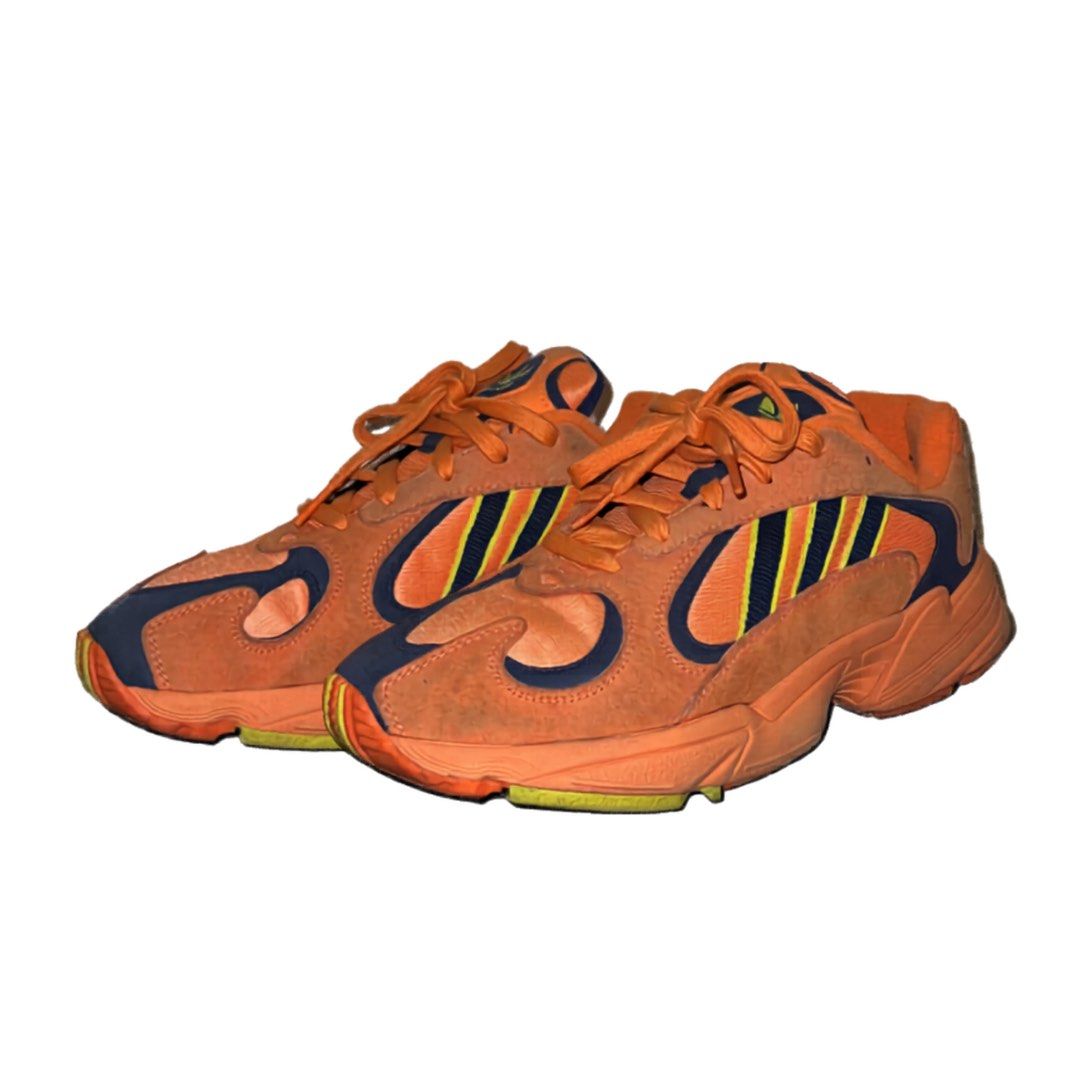 Adidas Yung-1 Orange Sneakers (Category: Sneakers) located in Quezon City. Submitted by zhobby (Listing ID 1432109926, Image 1). Description: - Adidas Yung-1 sneakers - Eye-catching orange colorway - Navy and yellow three stripes detail - Chunky sole for a bold look - Navy accents on sides and toe - Orange laces.