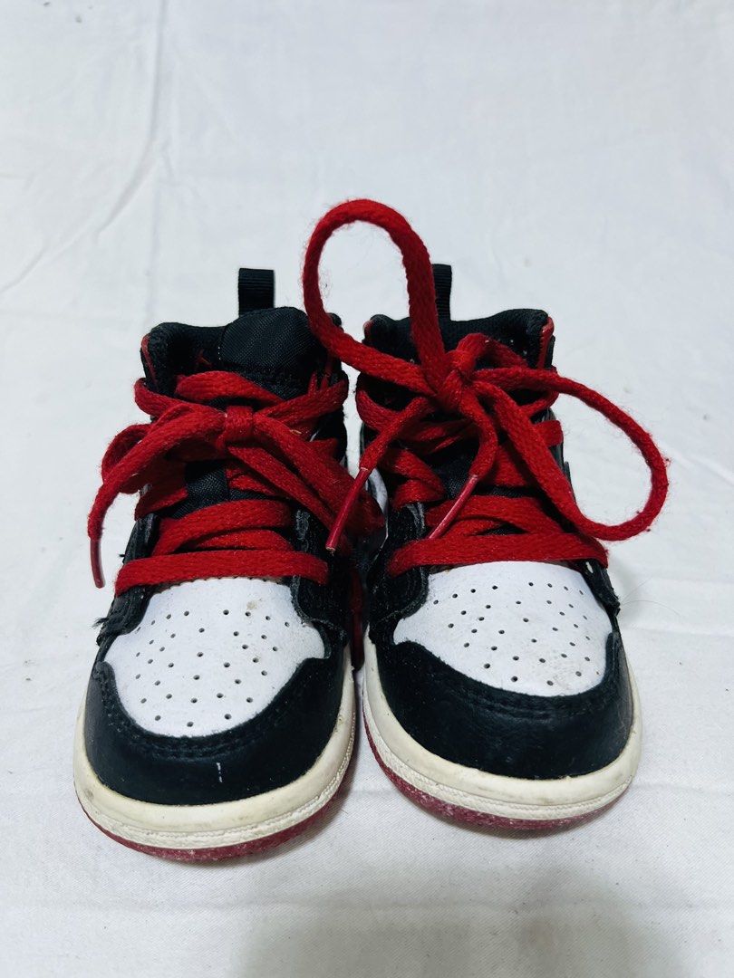 Air Jordan 1 Mid Infant Sneakers (Category: Babies & Kids Fashion) located in San Fernando. Submitted by isayet (Listing ID 1432166448, Image 1). Description: - Infant Air Jordan 1 Mid sneakers - Color: Black, white, and red - Features Nike swoosh - Red laces - Pull tab at the back - White and red soles - Designed for toddlers.