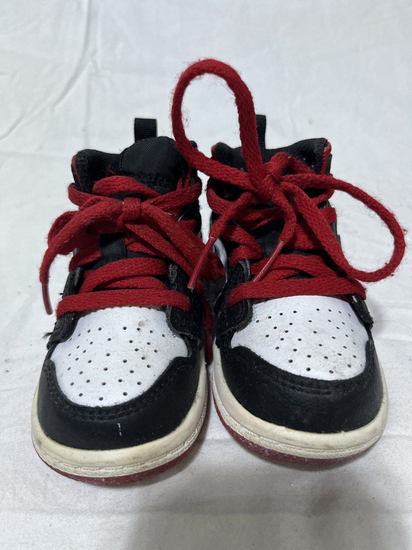 Air Jordan 1 Mid Infant Sneakers (Category: Babies & Kids Fashion) located in San Fernando. Submitted by isayet (Listing ID 1432166448, Image 3). Description: - Infant Air Jordan 1 Mid sneakers - Color: Black, white, and red - Features Nike swoosh - Red laces - Pull tab at the back - White and red soles - Designed for toddlers.