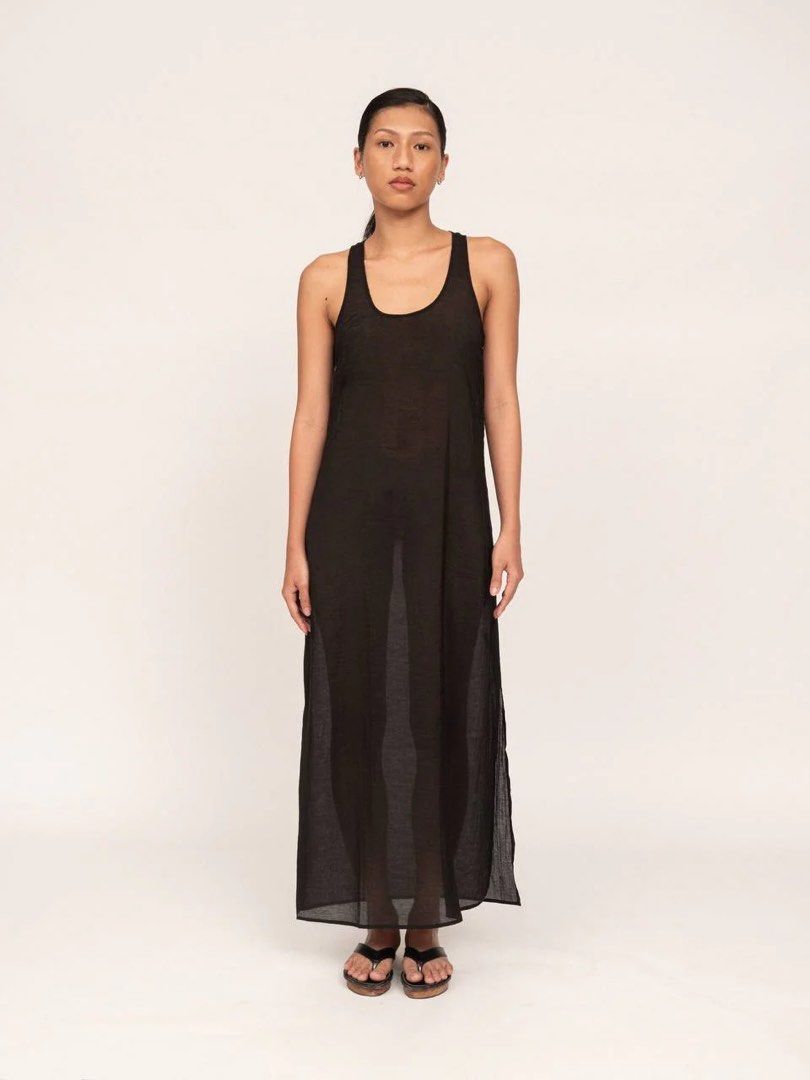 Apara Studio black racerback dress (Category: Dresses) located in Pasig City. Submitted by lexnthecity (Listing ID 1432056497, Image 1). Description: A sheer sleeveless dress designed to fall at the ankle with a racer back cut. Featuring a side slit for ease of movement. Material is a lightweight organza. Model is 5’6 and wearing a size small. EXCELLENT CONDITION. USED ONCE.