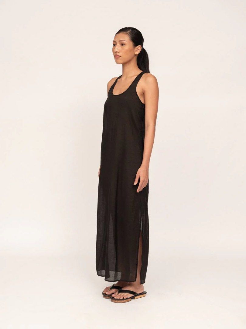 Apara Studio black racerback dress (Category: Dresses) located in Pasig City. Submitted by lexnthecity (Listing ID 1432056497, Image 2). Description: A sheer sleeveless dress designed to fall at the ankle with a racer back cut. Featuring a side slit for ease of movement. Material is a lightweight organza. Model is 5’6 and wearing a size small. EXCELLENT CONDITION. USED ONCE.