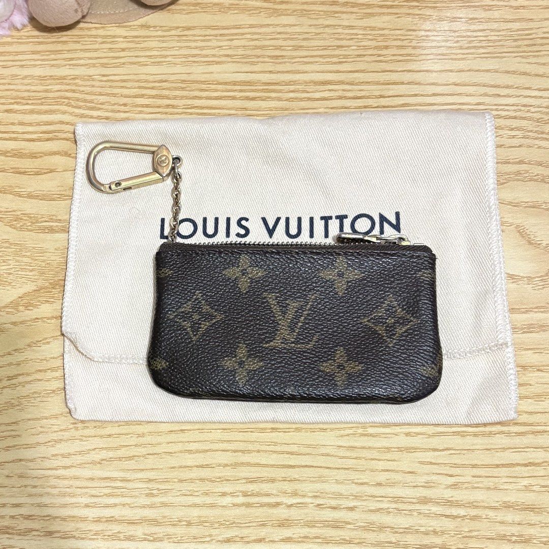 Authentic Louis Vuitton Key Cles Monogram Pouch Vintage (Category: Luxury Bags & Wallets) located in Manila. Submitted by ervy_ (Listing ID 1432006276, Image 2). Description: - Authentic Louis Vuitton key pouch - Classic monogram canvas - Zip closure - Key ring included - Comes with original dust bag - Brown leather interior - Ideal for keys, cards, and small items - A fashionable and functional accessory - With serial - Fixed price - Issue: fadi