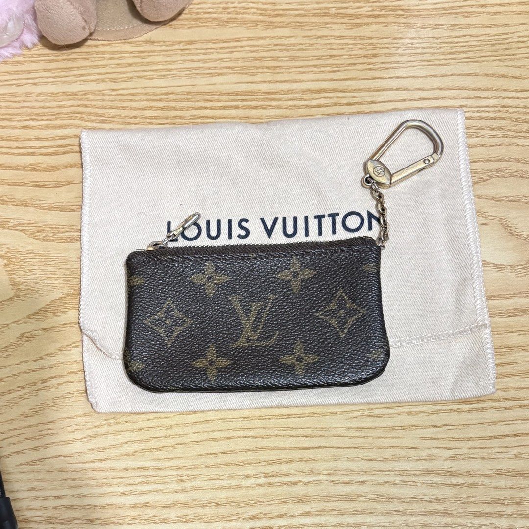 Authentic Louis Vuitton Key Cles Monogram Pouch Vintage (Category: Luxury Bags & Wallets) located in Manila. Submitted by ervy_ (Listing ID 1432006276, Image 1). Description: - Authentic Louis Vuitton key pouch - Classic monogram canvas - Zip closure - Key ring included - Comes with original dust bag - Brown leather interior - Ideal for keys, cards, and small items - A fashionable and functional accessory - With serial - Fixed price - Issue: fadi