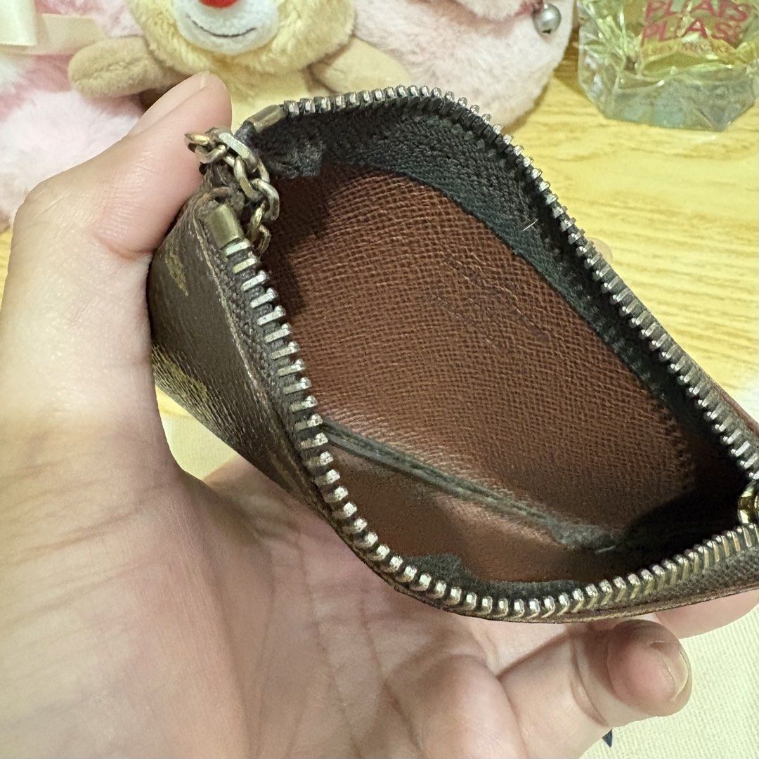 Authentic Louis Vuitton Key Cles Monogram Pouch Vintage (Category: Luxury Bags & Wallets) located in Manila. Submitted by ervy_ (Listing ID 1432006276, Image 3). Description: - Authentic Louis Vuitton key pouch - Classic monogram canvas - Zip closure - Key ring included - Comes with original dust bag - Brown leather interior - Ideal for keys, cards, and small items - A fashionable and functional accessory - With serial - Fixed price - Issue: fadi