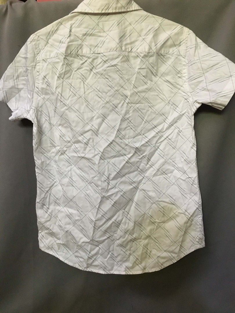 Baleno White Button Down Shirt - Geometric Lines - Size [XS] (Category: Tshirts & Polo Shirts ) located in Bulacan. Submitted by cosmos_thrift (Listing ID 1432117142, Image 3). Description: •Title: Baleno White Button Down Shirt - Geometric Lines - Size [XS] •Description: UNISEX (XS for Men) (S-M for Women) •Price: 350.00 (negotiable) •Payment Methods: Gcash •Delivery options (shoulder by buyer): J&T, Grab, Lalamove, Angkas PLSS MANAGE YOUR EXPEC