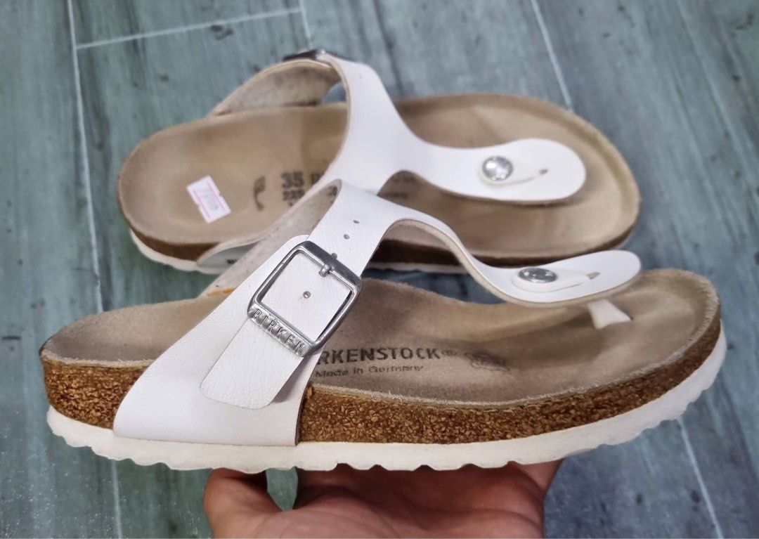 Birkenstock Gizeh White Sandals Size 35 (Category: Flats & Sandals) located in Danao, Cebu. Submitted by altheaprelovedcorner (Listing ID 1432193673, Image 2). Description: - Birkenstock Gizeh sandals - Color: White - Size: 35 - Design: Thong strap - Closure: Buckle - Footbed: Cork - Features Birkenstock logo - Made in Germany.