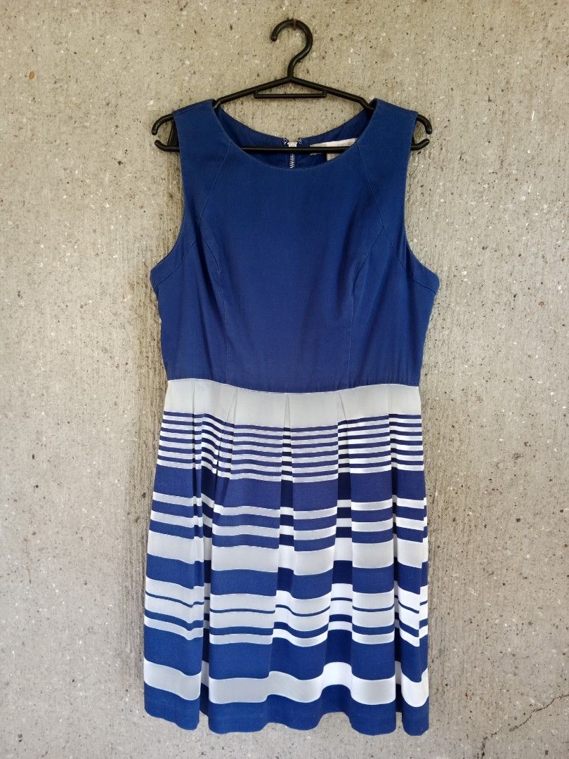 Blue and White Striped Dress (Category: Dresses) located in Batangas. Submitted by purplesummer_ph (Listing ID 1432026141, Image 1). Description: - Sleeveless dress - Blue bodice - Striped skirt (blue, white, gray) - Back zipper closure - Fitted silhouette - Brand tag visible - Perfect for casual and semi-formal events.