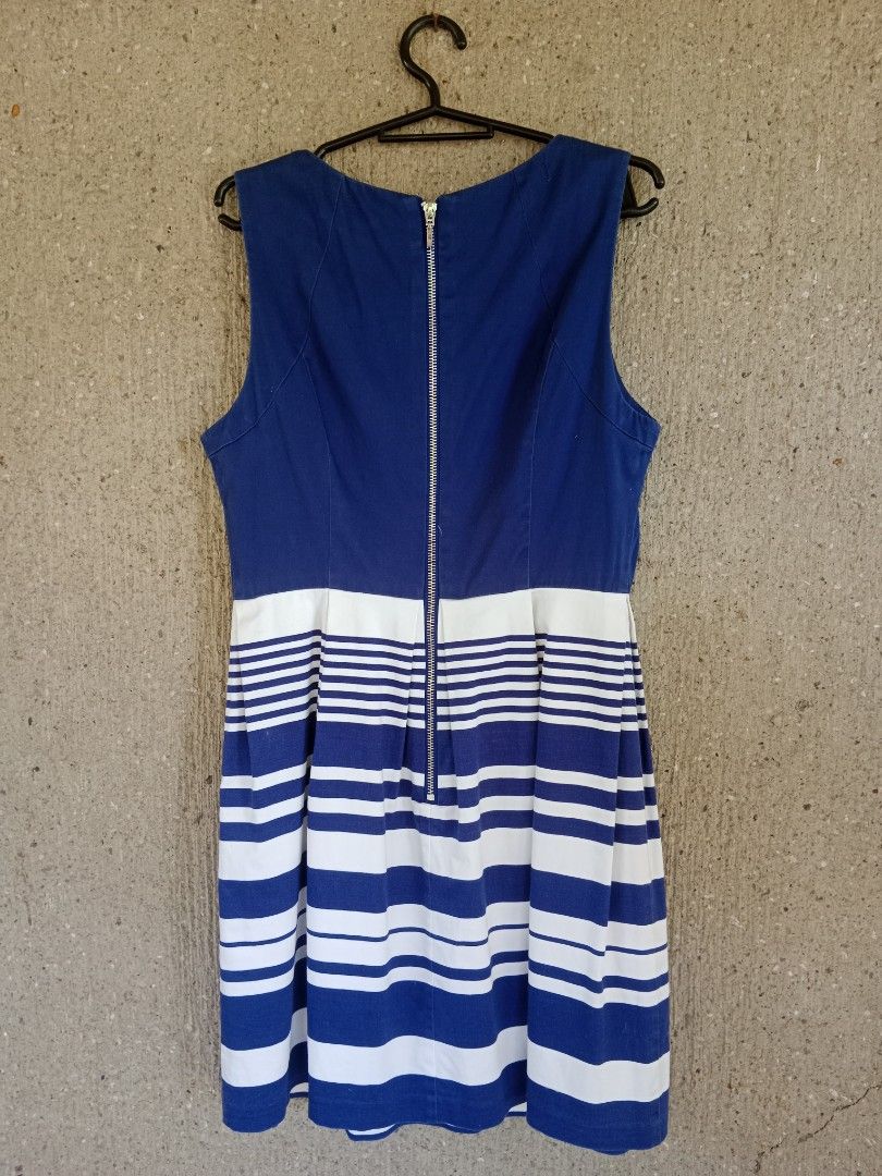 Blue and White Striped Dress (Category: Dresses) located in Batangas. Submitted by purplesummer_ph (Listing ID 1432026141, Image 2). Description: - Sleeveless dress - Blue bodice - Striped skirt (blue, white, gray) - Back zipper closure - Fitted silhouette - Brand tag visible - Perfect for casual and semi-formal events.