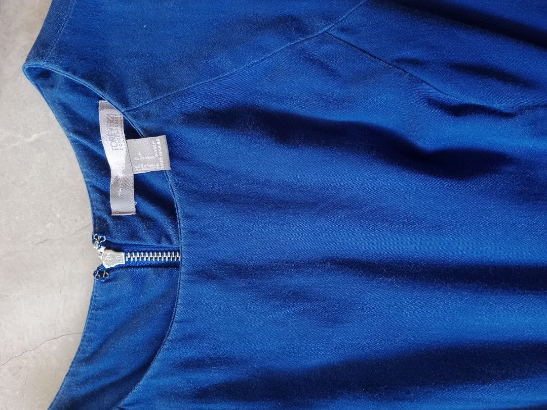 Blue and White Striped Dress (Category: Dresses) located in Batangas. Submitted by purplesummer_ph (Listing ID 1432026141, Image 3). Description: - Sleeveless dress - Blue bodice - Striped skirt (blue, white, gray) - Back zipper closure - Fitted silhouette - Brand tag visible - Perfect for casual and semi-formal events.