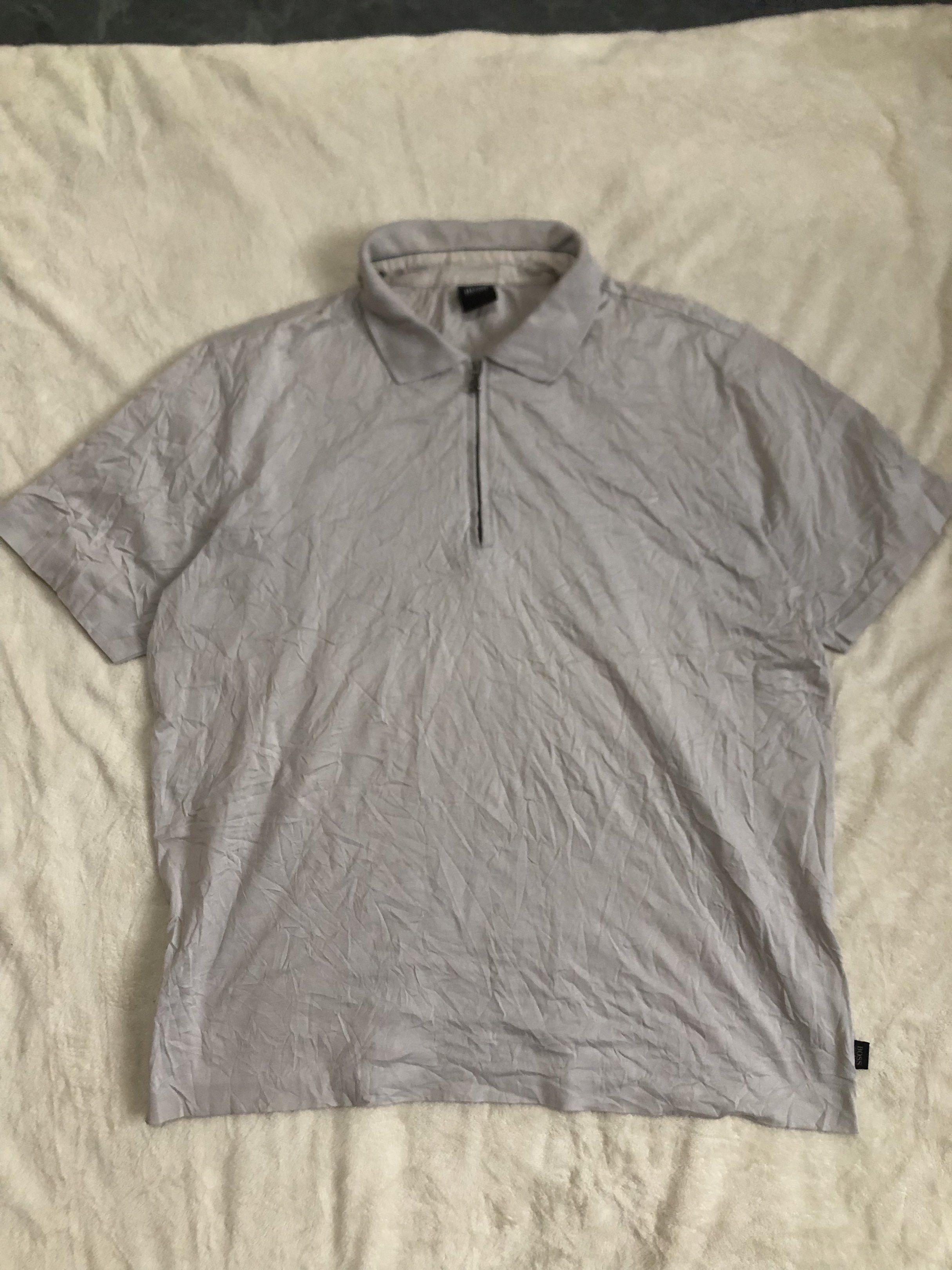 BOSS Hugo Boss Polo Shirt (Category: Tshirts & Polo Shirts ) located in Binalbagan. Submitted by kianbenedict024 (Listing ID 1432048601, Image 1). Description: - BOSS Hugo Boss polo shirt - Color: Gray - Features: Zip-up collar, short sleeves - Design: BOSS logo detail - Origin: Made in Romania - Size: Not specified.