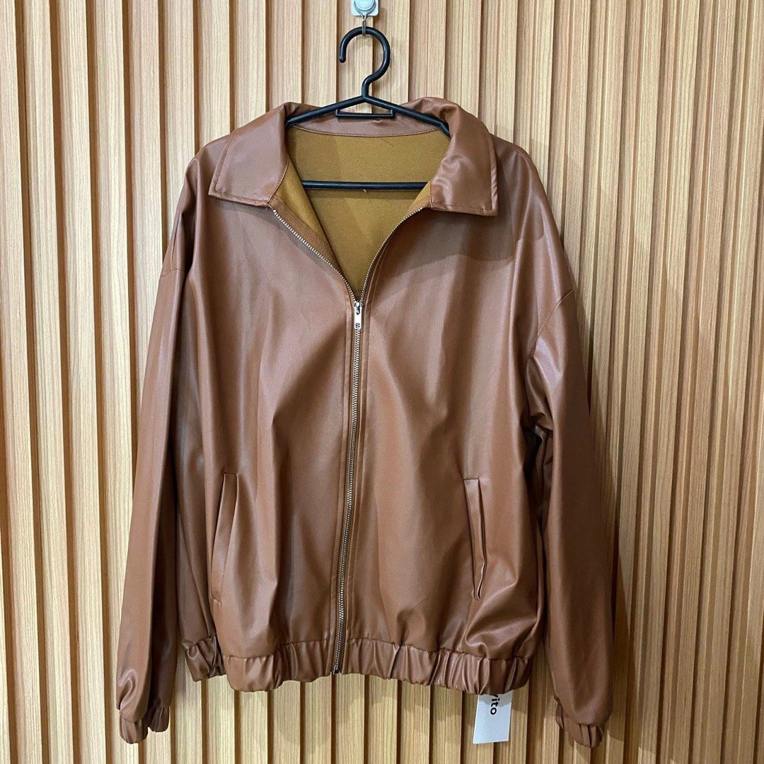Brown Leather Jacket (Lovito) (Category: Coats, Jackets and Outerwear) located in Manila. Submitted by declutt3r.2026 (Listing ID 1432052858, Image 1). Description: - Brown leather jacket - Full zipper closure - Collared neckline - Elastic cuffs and hem - Two front pockets - Suitable for casual and semi-formal wear.