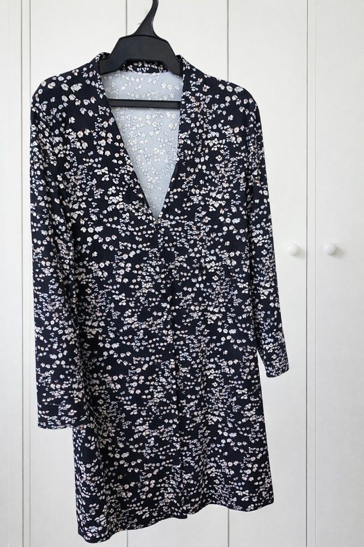 Bundle sale: 3 Mango Floral Short Dresses (Category: Dresses) located in Manila. Submitted by fiorprettyshoppe (Listing ID 1432032312, Image 2). Description: Dress features a long sleeve design with a floral print. The dress is made of a soft, flowing fabric, perfect for casual wear. 400 pesos each. .