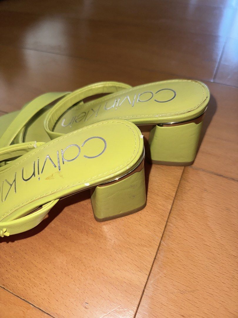 Calvin Klein Lime Green Sandals (Category: Flats & Sandals) located in Muntinlupa City. Submitted by _angelfenton (Listing ID 1432008321, Image 2). Description: - Lime green Calvin Klein sandals - Features a stylish block heel - Strappy design - Calvin Klein logo on insole - Signs of wear on sole - Size sticker present RFS I have too many heels I don’t wear and I don’t have space na.