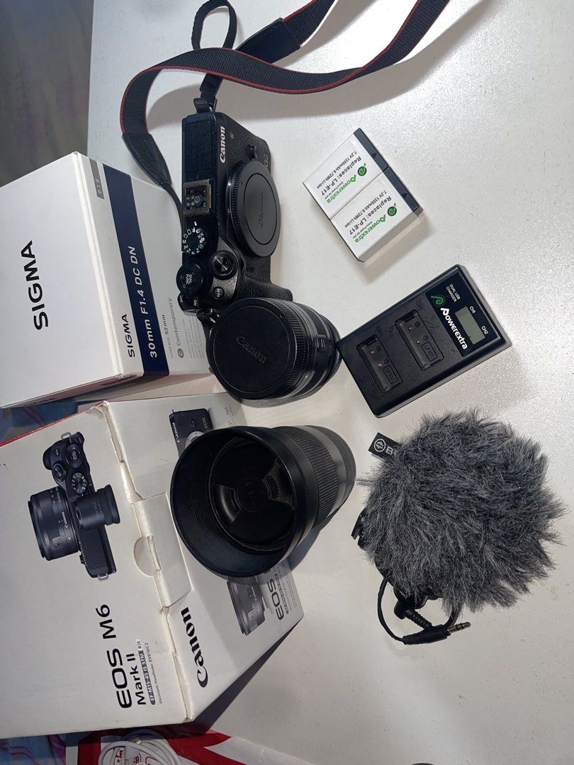 Canon EOS M6 Mark II with Sigma 30mm Lens (Category: Cameras) located in Manila. Submitted by nelsonpera88982 (Listing ID 1432041274, Image 1). Description: FOR SALE: Canon M6 Mark II (Body + Lens + Accessories) 📸 Gently used, for personal use only What’s included: - EF-M 15-45mm IS STM Lens - SIGMA 30mm F/1.4 DC DN Contemporary Lens for CANON EF-M (complete box) - 1 Charger + 2 Aftermarket Powerextra Batteries - 1 Original charger + 1 original 