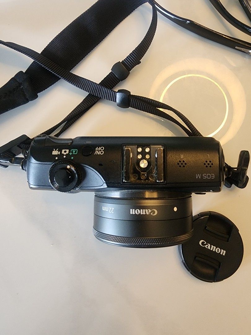 Canon EOS M Mirrorless Camera | EF-M 22mm f/2 STM Lens | w/ Charger + Battery | Black (Category: Cameras) located in Quezon City. Submitted by rrryyysellsstuff (Listing ID 1432009778, Image 2). Description: ✅ Canon EOS M Mirrorless Camera — Lightly Used, Well-Maintained 📷 WHAT YOU GET: • Canon EOS M camera body (Black) • Canon EF-M 22mm f/2 STM pancake lens • Lens cap • Camera strap • Original charger • 1 battery (LP-E12) (No box) 📄 KEY SPECS: 