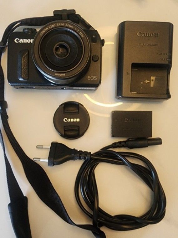 Canon EOS M Mirrorless Camera | EF-M 22mm f/2 STM Lens | w/ Charger + Battery | Black (Category: Cameras) located in Quezon City. Submitted by rrryyysellsstuff (Listing ID 1432009778, Image 1). Description: ✅ Canon EOS M Mirrorless Camera — Lightly Used, Well-Maintained 📷 WHAT YOU GET: • Canon EOS M camera body (Black) • Canon EF-M 22mm f/2 STM pancake lens • Lens cap • Camera strap • Original charger • 1 battery (LP-E12) (No box) 📄 KEY SPECS: 