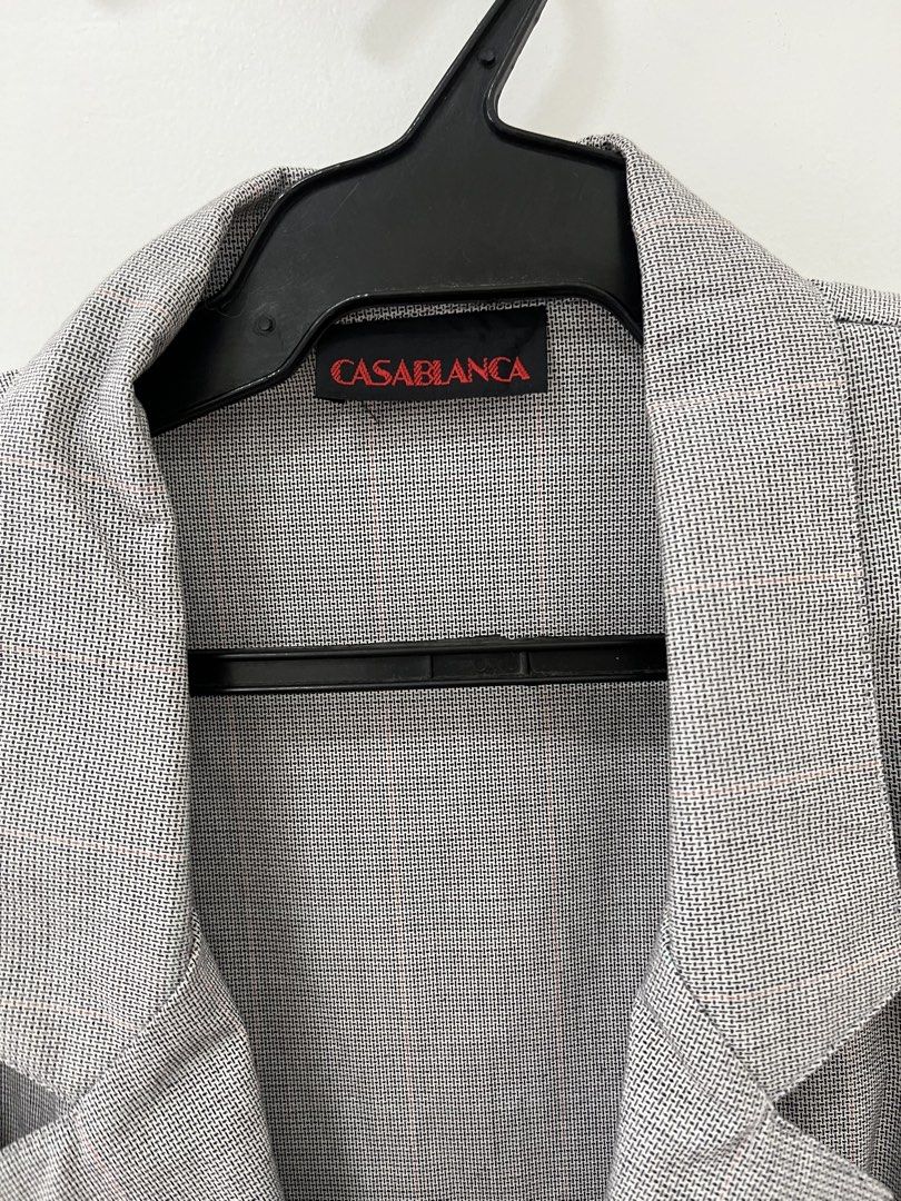Casablanca Gray Blazer (Category: Coats, Jackets and Outerwear) located in Cavite. Submitted by letsgosab (Listing ID 1432195604, Image 3). Description: - Casablanca gray blazer - Classic design - Notched lapel - Two front pockets - Single-button closure - Long sleeves - Tailored fit - Casablanca logo visible - Subtle textured pattern.