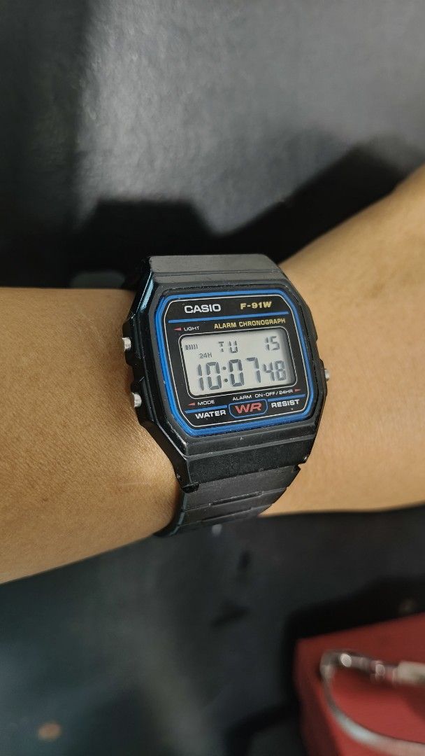 Casio F-91W Digital Watch (Category: Men's Watches) located in Taguig. Submitted by mercyeugen28914 (Listing ID 1432150619, Image 2). Description: - Casio F-91W Digital Watch - Black resin strap - Displays time, date, and day - Features alarm and light functions - Water resistant.