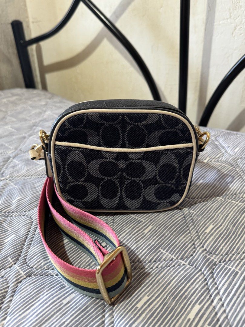 coach mini dempsey camera bag (Category: Luxury Bags & Wallets) located in Danao, Cebu. Submitted by jojie.1983 (Listing ID 1432054316, Image 2). Description: - Authentic Coach crossbody bag - Signature Coach pattern - Rainbow strap - Gold-tone hardware - Zip closure - Circular logo detail - Interior: Black - Includes small tag - Made in Cambodia.